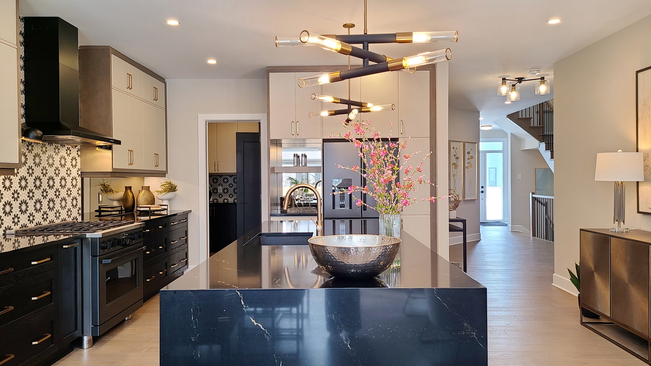 idylea model homes tartan homes ottawa brighton single-family kitchen glitz island waterfall counter geometric tile