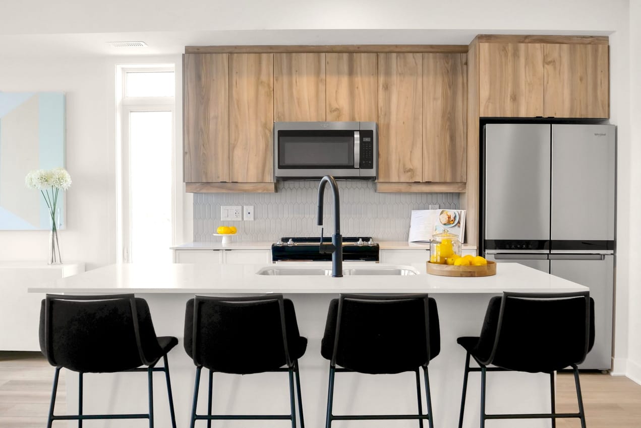 model homes by Urbandale Construction Ottawa knightsbridge two-tone kitchen black bar stools Leitrim flats
