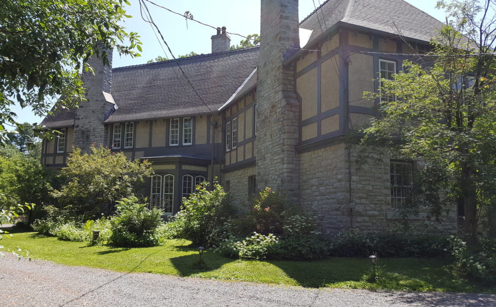 The Glen Tudor Revival manor mansion