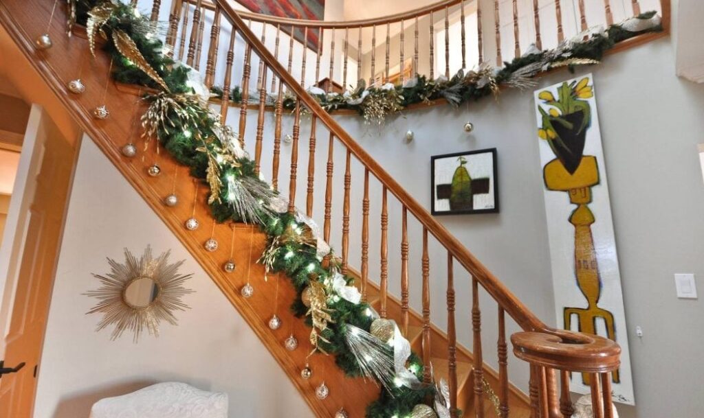 Homes for the Holidays Trillium Floral Designs Christmas decorating banister garland